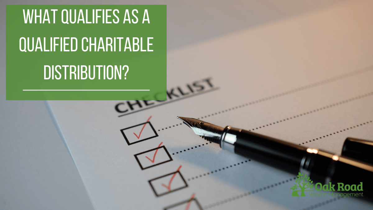 A checklist with a fountain pen titled "What qualifies as a qualified charitable distribution?" used to illustrate 2026 IRA tax donation rules.